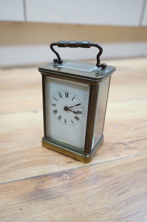 An American Seth Thomas mahogany wall clock and a French carriage timepiece, largest 55cm high. Condition - fair to good, untested